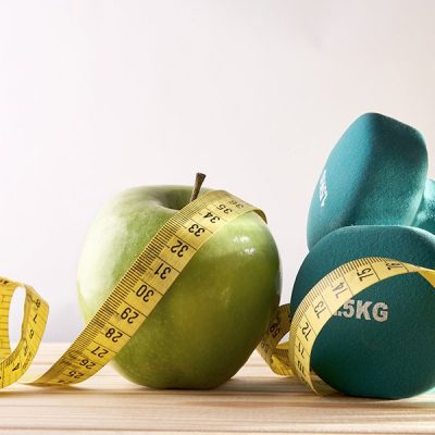 An apple and tape measure
